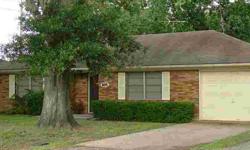Very nice brick home in old Katy. Large den has hardwood floor u(nder the carpet), tile counters in kitchen, large utility room. The house has a one car attached garage and there is another detached garage with a large area for a workshop. Ceiling fans,