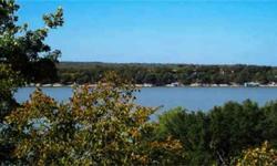 Spectacular waterfront building site - 4.80 acres in the premier gated community of Deep Water Estates at Lake Brownwood. Gated entrance, paved roads & building restrictions. Incredible views with 213 ft water frontage. Seller will consider owner