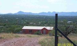 New Kitchen Cabinets, Tile Thru out, Paint in and out, Just waiting for a new owner! Located in Historic Arivaca on Paved Arivaca Road 2 miles to Townsite.. Private well and Great Views.Listing originally posted at http