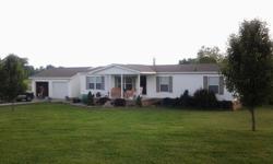 2005 Clayton 28x60 3 bedroom 2 bath doublewide with 2 car detached garage with electric and above ground pool sitting on almost 3 acres master bath has garden tub, firelplace in living room, and a seperate utility room.....kitchen, living & dining room