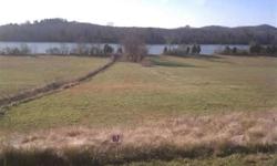 $95,000. 1.75 Acre waterfront lot in an upscale gated community on Chickamauga Lake. Lot is nicely cleared and ready for your building plans. Only 30 miles from Chattanooga for a quiet, beautiful get-away Presented by Lynda Moore, Broker, REALTOR(R), ABR,