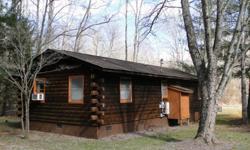 Cedar log cabin, duplex, with creekfront property (1/2 acre). More land is available. There is a greatroom with kitchen, bedroom and bath on each side of the cabin with an interior adjoining door. Previously used as vacation rentals. Beautiful area in