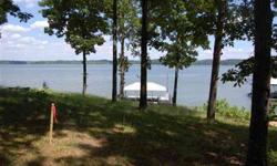 This wooded, waterfront lot may be just what you're looking for! Located on Kentucky Lake, it offers a great view, .46 acres and is dockable with permit. Offering a fairly gentle slope to the water, the lot is your gateway to all that Kentucky Lake and