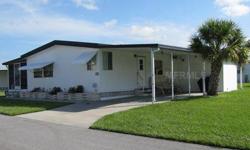 Spend your winters in this spacious and sunny double wide mobile home with plenty of room for your guests or expanded family. This home has many upgrades including