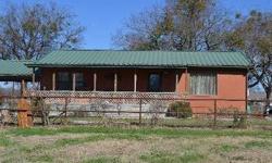 Country charmer on 1.7 acres. Frame home with metal roof, rain gutters, covered front porch, open back patio, , fenced yard, dog pen, barn with 1 16x11 stall with 16x12 feed room water and electricity to barn, round pen and 3 other pens with two of them