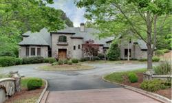 Old world estate situated on 3.23 acres in The Homestead, an exclusive private gated community in Johns Creek! Two story foyer with turret stairs, fireside living room/study, chef's kitchen with stone counter tops and stainless steel appliances, fireside