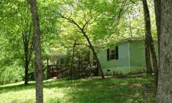 -Enjoy this private home on 2.24 acres including Lots 5 & 7. Potential for future growth on the lovely wooded land. Sit on the large covered deck and enjoy the sounds of the creek and nature. Over 1500 sq. ft. featuring open and bright rooms, split