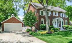 Situated on premiere park-like setting this stunning center-entry 4 bedroom, 2.5 bath brick Colonial offers charm coupled with the finest finishes. Grand floorplan, rich hardwood floors, spacious formals, wood burning fireplace, pristine eat-in kitchen
