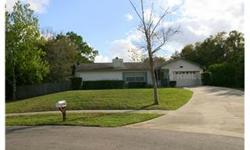 SHORT SALE. Great 3/2 with LARGE stone fireplace in the front living room with fenced yard and screened porch. A+ schools at the end of a culdesac. OVIEDO one of the top 100 towns in the USA! Needs work but has great potential. LARGE yard! Garage has