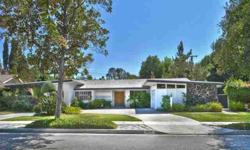 This wonderful diamond in the rough is located on a sprawling flat lot South of the Boulevard in Tarzana. The 6 bedroom, 4 bath single story contemporary evokes memories of a bygone era. Designed with comfortable livingand& entertaining in mind, the