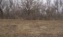 Undeveloped Property 6.97 acres of wooded ground in center of Evansdale. Develop 6 lots and have woods and creek run thru it. Some engineering done. 319-404-1744 Price