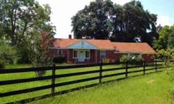 Looking for a small cottage with acreage for your horses? This two bedroom, one bath brick cottage has its own charm and style with nice hardwood floors, knotty pine tongue-n-grove walls, newer carpet & windows in the bedrooms, newer electrical, H/W