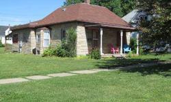 This bungalow style 2 bedroom home has a perfect front porch, spacious bedrooms, kitchen with lots of cabinets, back screened porch, large open yard and double garage. Listing agent and office