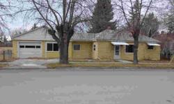 This home sits on a large corner lot on the very edge of town. The interior has been nicely remodeled with new wiring, new insulation, some new windows, new carpet, new paint and a totally NEW kitchen. There is an area in the living room that would work