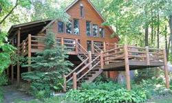 For those who appreciate the beauty and serenity of waterfront living, this 4 bedroom, 3 bath picture-book full log home set on a deep wooded lot with 100' of gradual frontage can be your famiy getaway. Featuring an open sleeping loft with 2 built in