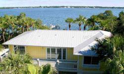 Stunning bayfront home set on 157 feet of bay frontage with some of the key's deepest water and most panoramic bayviews. Features include