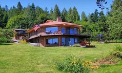 Experience commanding views of the Straits & San Juan Islands from this magnificent 1.22 acre water front property on beautiful Sequim Bay. Approximately 174 feet of frontage complete with tidelands & a 1/3 share in a hard to find deep water DOCK.