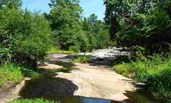 152 ac +/- heavily wooded tract just 6 miles north of Rolesville. Extensive road system throughout property. Large stream flowing over beautiful rock outcroppings. Priced significantly below other parcels this close to the Triangle. Almost 75% reduction