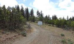 Very pretty 8.5 ac property at the end of the road. Lrg 36x30 shop, concrete fl, wired. Well, power, and septic in to 1967 single wide that could be very livable with TLC or it haul off. Some trees, open space, seasonal creek, mostly level, nice views