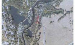 BUILDING LOT ON THE RAINBOW RIVER.THERE IS APPROXIMATELY 2 ACRES IN THE PARCEL WITH .75 ACRES ABOVE THE ORDINARY HIGH WATER LEVEL,PER SURVEY.PRIVATE CLEARED BUILDING SITE.CITY WATER AND SEWER AVAILABLE.