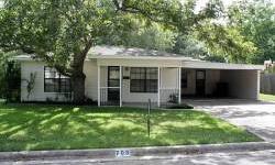 At 706 N. Market St. mature pecan and oak trees on .437 acre in a quiet neighborhood provides the setting for a three bedroom, two bath home with an inviting front porch to welcome family and friends. The living area - inside and outside - provide plenty