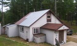 Cabin on 40 acres. 2 bedroom, 3/4 bath with loft. Lots of privacy best describes this property. Located 1/4 mile off a paved county road, with deeded access, this parcel is centrally located near both McDonald & Gulliver Lake public access sites and miles