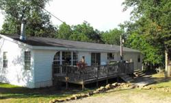 Very nice manufactured double wide with 3.55 acres. This well maintined home features two living areas, office space, 4 bedrooms with nice closets, master suite has soaking tub, walk in shower, double sink vanity and two walk in closets. The cook of the