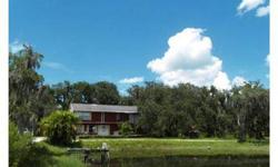 North Merritt Island - 2 Story Home on 5 Acres with fish pond & plenty of land for horses. Home is not complete, although livable, it needs alot of T.L.C. but the overall property is a great price for anyone searching for their own beautiful piece of