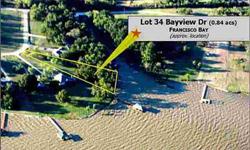 Beautiful waterfront lot that is ready for your dream home! 138ft of retaining wall with fabulous lake views, culvert driveway & large pecan trees. Francisco Bay is a gated community with boat ramp, community pavilion and pool. Restricted to site built