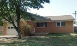 Opportunity is Knocking! Charming brick ranch conveniently located in West Wichita. Plenty of shade is provided by mature trees that keep the sun off the house; this means lower electric bills. Enjoy the comfortable sized living room with picture window