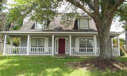 Lovely 3/2 home in Daphne. 2 car carport, hardwood floors in family room, fireplace with mantle in family room, split brick floors in kitchen, chair rail in dining room and family room, vanity in master bath, spacious laundry room with cabinets. Great