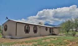 This beautiful 3 bedroom, 2 bath manufactured home on 4 acres of horse property is just minutes from Sierra Vista, Ft. Huachuca, shopping and schools. The property has a barn, 2 covered pens, a storage shed and a horse pasture. The quiet neighborhood and