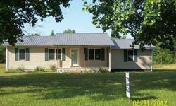 Nice Vinyl Ranch Home with Hardwood Floors. Useable acreage behind the house.Listing originally posted at http