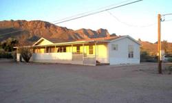 Beautiful home privately nestled next the Goldfield Mountains. This home is move in ready. This four bedroom, split floor plan home has plenty of room for the large families. There is a family room and step down living room perfect for entertaining. The
