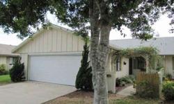 2BR/2BA with 2-car garage. New wood laminate floors in living area and kitchen. Newer architectural shingled roof. Nice oak trees front and rear for cool breezes. Low annual HOA dues include standard cable TV, subterranean treat and repair termite bond,
