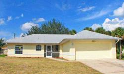 North Port - Three bedrooms and two baths with 1174 sqft under air built in 2005 on 10,000 sqft of land. Kitchen with breakfast bar overlooks the combination living and dining room with raised ceilings. Split bedroom plan. Large screened lanai overlooks