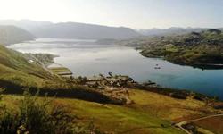 Approximately 899 ACRES of extraordinary real estate located in the nucleus of Eastern Washington's retirement, recreational, and agricultural region which includes the evolving and gorgeous vineyards of Lake Chelan. Within this peaceful destination