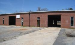 Commercial building located on the western side of downtown Seneca. It is a block building with brick facade is currently divided into 5 spaces. Space is flexible and could be used for multiple tenants or combined for one. There are rollup doors on the