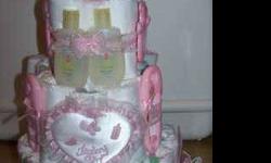 BABY DIAPER CAKES. PHOTO SHOWS 1 FOR A GIRL. DIAPER CAKE HAS 37 DIAPERS, 2 BIBS, two FEEDING SPOONS, four LITTLE GIRL BARRETES, two BABY WASH. GREAT FOR A BABY GIFT OR BABY SHOWER CENTERPIECE. CALL TINA 254-698-2739 OR EMAIL (click to respond).