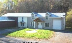 Rare Residential and Commercial Property with Convenient Location on Rt. 9 in Berkeley Springs. Property has 5 Bedrooms, 3 Baths, and 5 Garage Bays all on 1.45 acres fronting on Rt. 9. Public Water and Sewer. Open your own Garage, live in the adjoining