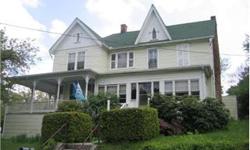 Spacious Victorian - In downtown Berkeley Springs this home could be your own B&B. 5 BRs, 2 BAs, 2 kitchens, parlor, dining room, living room, family room w/gas fireplace, front porch, 2 enclosed porches, patio, wood floors, 9 foot ceilings, oil heat,