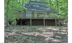 Coolfont - great contemporary in the woods. New heating/ac systems, new roof, new engineered wood flooring in foyer, great room, kitchen; recently painted inside and out, new wood stove. Four bedrms, 2 baths, screened porch, deck, public water and sewer.