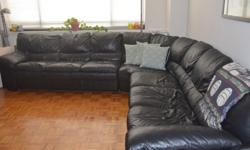Large, black, leather sectional sofa in perfect condition. Extremely comfortable as well! 3 sections that form an "L" or middle can be taken out and used as a large chair. Each portion of the "L" is 10.5 feet.Roughly 3 feet deep.