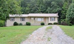 Brick, 3 bedroom, 1 1/2 baths, Den, full basement, hardwood and tile flooring. Central heat and air, circle drive. 3+ acres Located in Bumpus Mills, TN. By Owner.. 931-232-5750