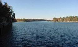 Lewis Smith Lake-Rock Creek-Wooded lot with a rock shore line. Deep year. round water, great views with an easy access to the water. Close to a marina for gas convenience. Minutes from Arley for shopping at Grocery, hardware, churches, schools,