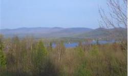 (1497)VIEW WHAT A VIEW!! Overlooking Lake Umbagog and the Presidential MT Range 35 acres subdivdable has a previosly aproved 5 lot subdivision connects to snowmobile trails, close to atv trails, borders the federal wildlife refuge, close to skiing, and