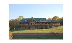 Situated on 28 acres, this 7,000 +/- sq foot home includes a huge open great room w/floor to ceiling windows, vaulted & beamed ceilings, gorgeous stone fireplace and a view to the upper level. The master suite is located on the main level and there are 5