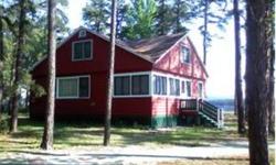 ~RARE OPPORTUNITY~ Classic Ossipee Lake Cottage on 380 feet of sandy beach. Cottage has had many updates and been well taken care of. Poured retaining wall in excellent shape, alluminum raise-a-dock,outside fireplace,shuffle board and a BOAT HOUSE with