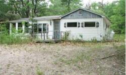 Cozy, 2 bedroom fixer upper camp set up on a knoll with seasonal view of Turtle Cove , Ossipee Lake. Good sized living room, kitchen and a semi finished porch. Property has a 25 foot waterfront lot on Spindle Point about 1/4 mile walk away. This is two