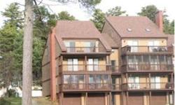 Beautiful Ossipee Lakefront Townhouse Condo top floor unit with lake views and Westerly exposure. Open concept living room area with wood fireplace, large sleeping loft, sliders to deck with awning. Being sold fully applianced. Onsite boat launch